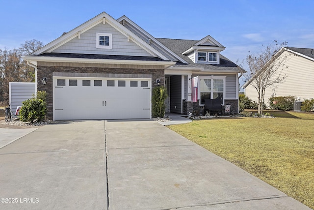 craftsman-style home with a garage and a front lawn