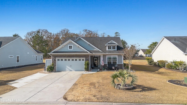 view of front of home with a garage and a front yard