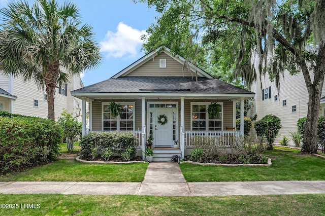 4 Savile Ave, Bluffton, SC 29910 - view of front of property featuring a shingled roof, a porch, and a front lawn