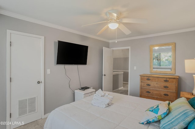 carpeted bedroom with ceiling fan and ornamental molding