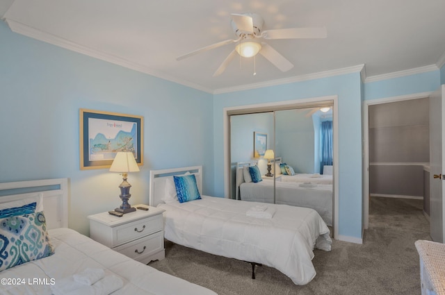 carpeted bedroom featuring crown molding, ceiling fan, and a closet