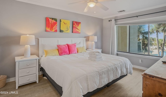 bedroom featuring ornamental molding and ceiling fan