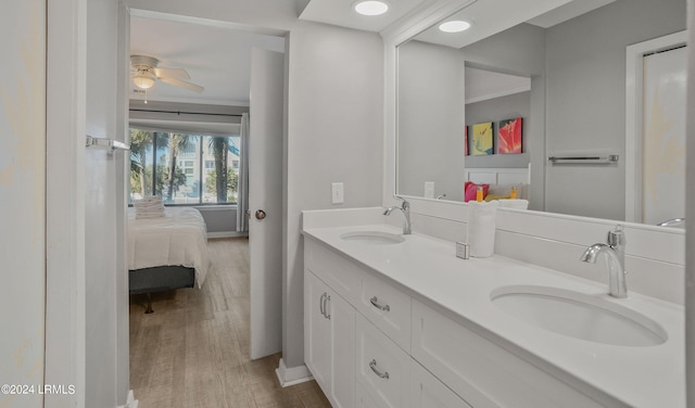 bathroom with vanity, hardwood / wood-style floors, and ceiling fan