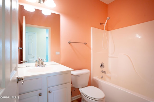 full bathroom with vanity, washtub / shower combination, and toilet