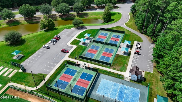 birds eye view of property with a water view