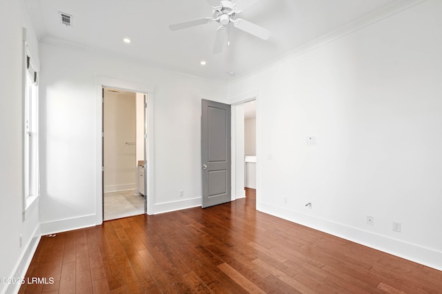 unfurnished bedroom with visible vents, crown molding, baseboards, hardwood / wood-style floors, and recessed lighting