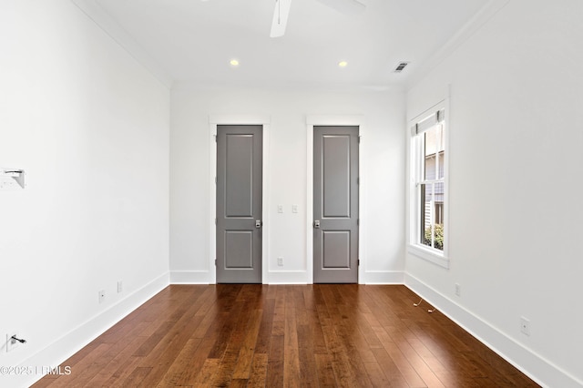 unfurnished bedroom with visible vents, recessed lighting, baseboards, and hardwood / wood-style flooring