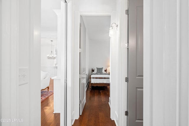 corridor featuring dark wood-type flooring