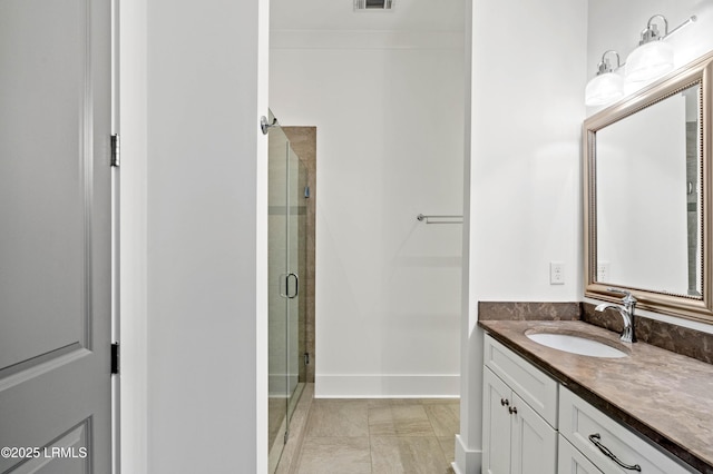 full bathroom with visible vents, a stall shower, vanity, and baseboards