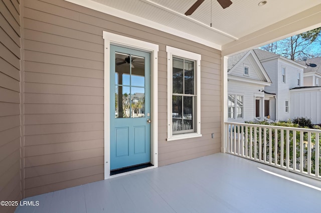 doorway to property featuring ceiling fan