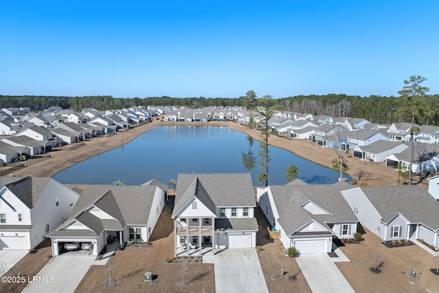 bird's eye view featuring a residential view and a water view