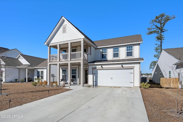 view of front of house with a garage and a balcony