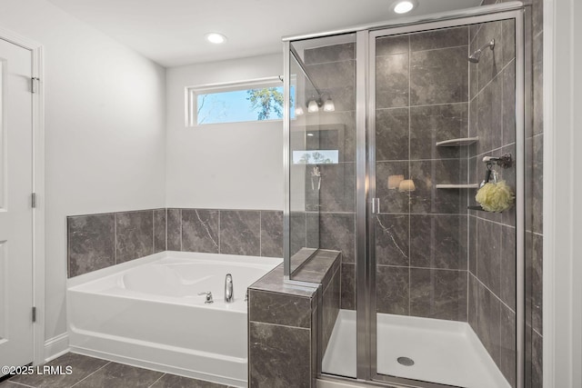 full bathroom featuring a bath, recessed lighting, and a stall shower