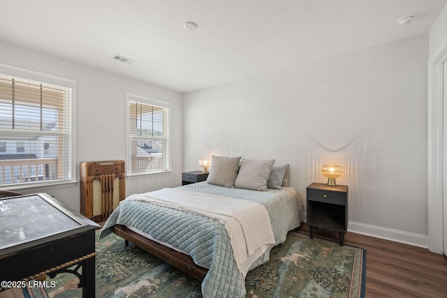 bedroom featuring dark hardwood / wood-style floors