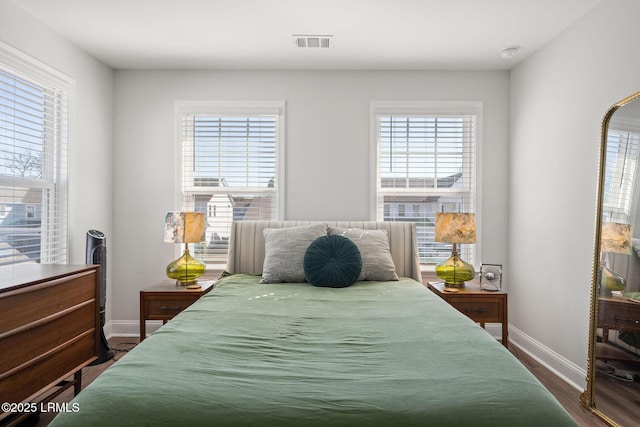 bedroom featuring hardwood / wood-style flooring