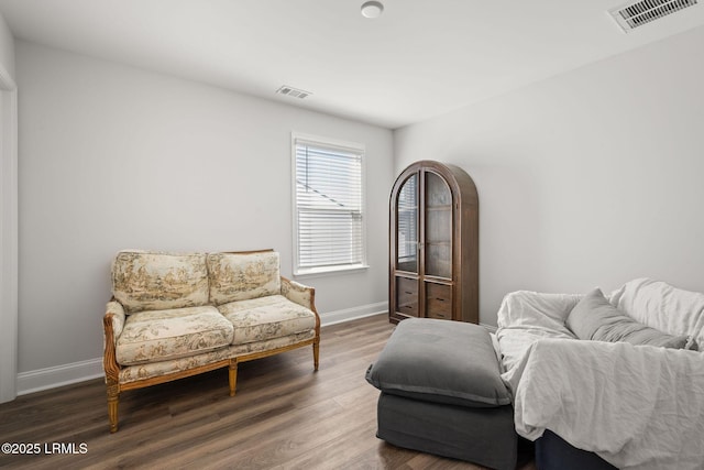 sitting room with dark hardwood / wood-style floors