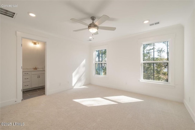 419 Parkside Commons, Bluffton, SC 29910 - unfurnished bedroom with carpet floors, multiple windows, recessed lighting, ensuite bathroom, and a ceiling fan