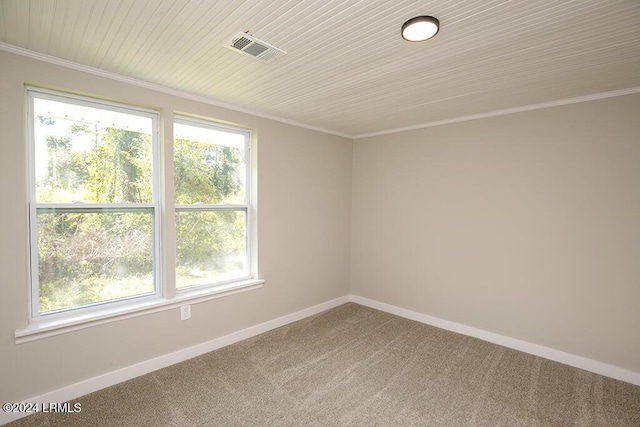 carpeted spare room with ornamental molding