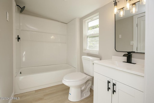 full bathroom featuring bathing tub / shower combination, vanity, wood-type flooring, vaulted ceiling, and toilet