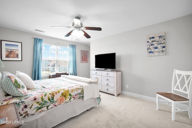 bedroom with ceiling fan, baseboards, visible vents, and light carpet