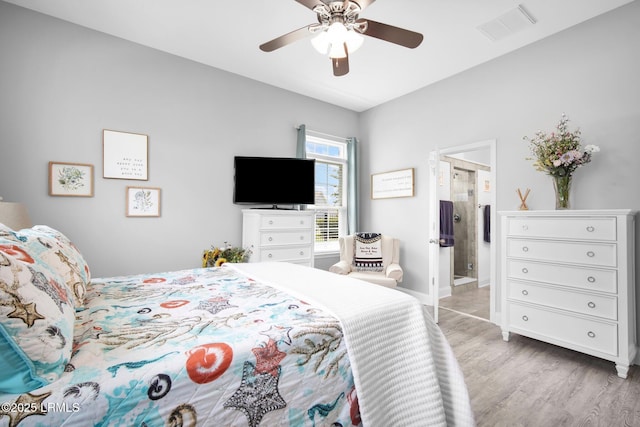 bedroom featuring connected bathroom, light wood-style floors, visible vents, and ceiling fan