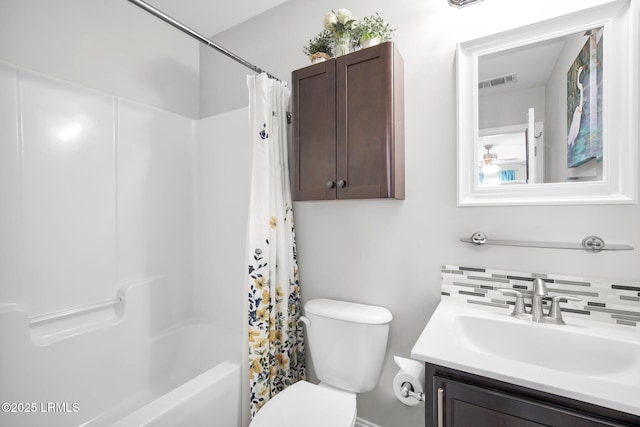 bathroom featuring visible vents, backsplash, toilet, shower / tub combo, and vanity