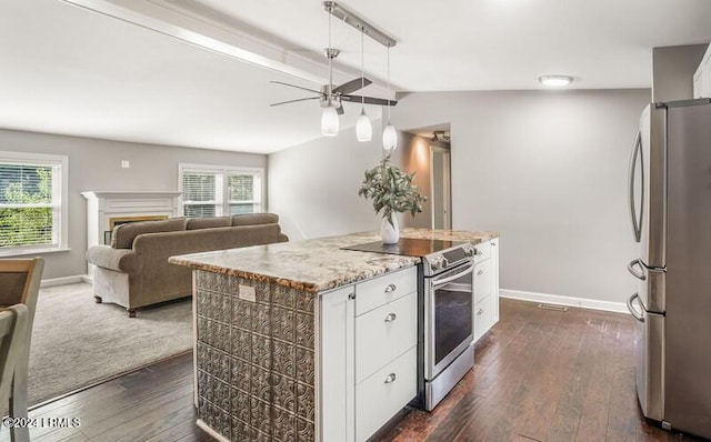 kitchen featuring white cabinetry, dark wood-type flooring, a kitchen island, and appliances with stainless steel finishes