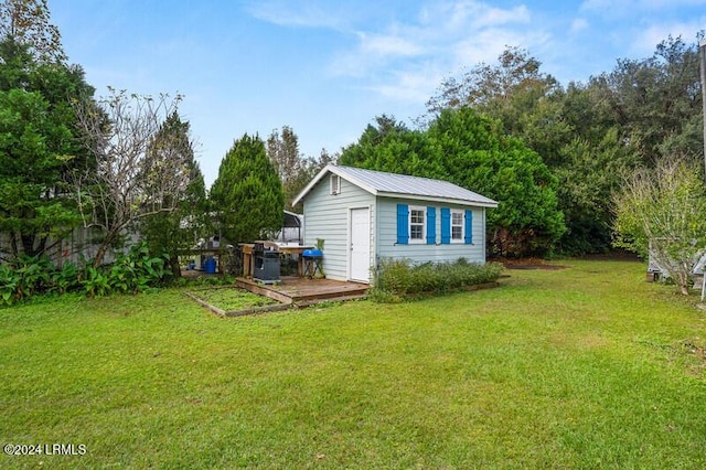 view of outdoor structure with a lawn