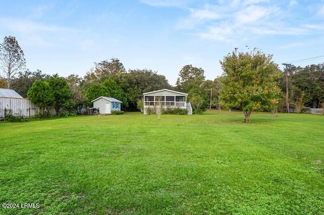 view of yard with a sunroom