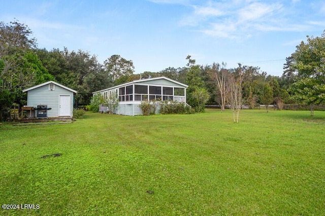 view of yard featuring a sunroom