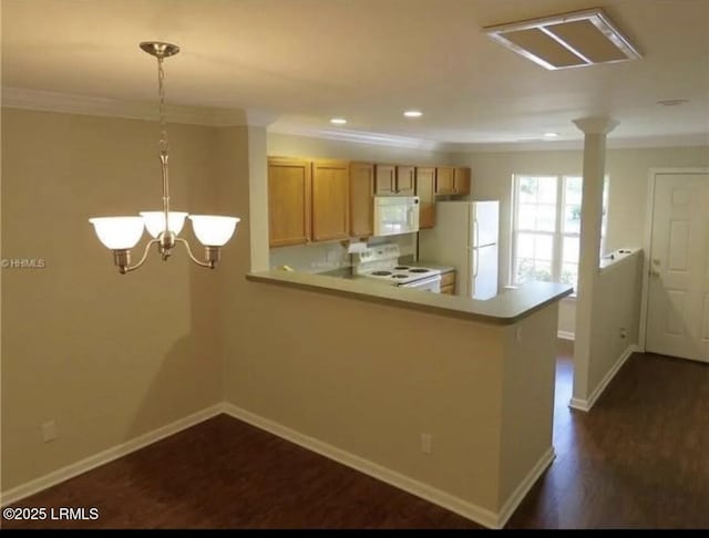 107 S St, Bluffton, SC 29910 - kitchen with white appliances, crown molding, dark wood-style flooring, light countertops, and a peninsula