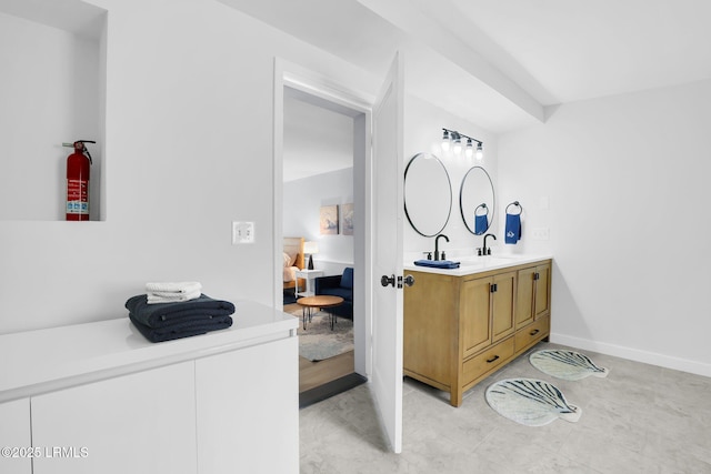 bathroom featuring double vanity and a sink