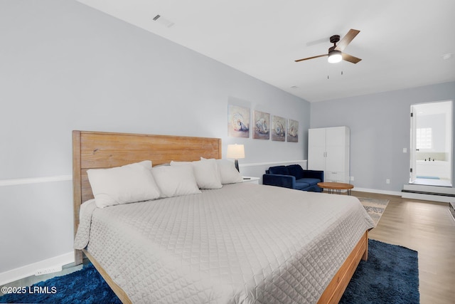 bedroom with visible vents, ceiling fan, wood finished floors, and baseboards