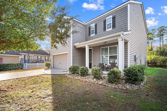 front of property with a garage and covered porch