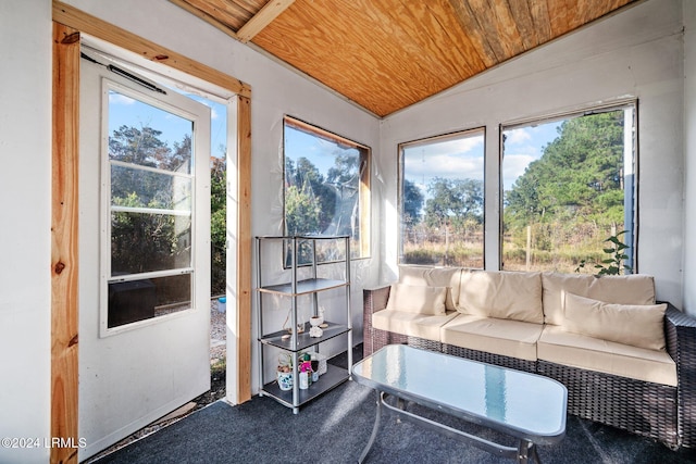 sunroom featuring lofted ceiling and wooden ceiling