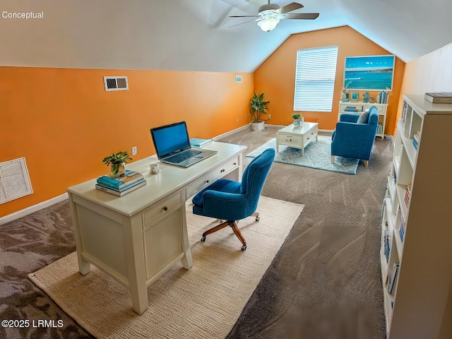 office area featuring light carpet, vaulted ceiling, visible vents, and baseboards