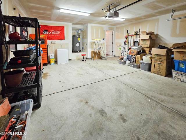 garage featuring a garage door opener and water heater