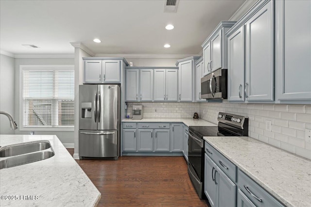 3614 Oyster Bluff Dr, Beaufort, SC 29907 - kitchen with dark wood-style floors, a sink, decorative backsplash, ornamental molding, and stainless steel appliances