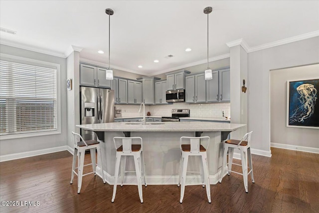 3614 Oyster Bluff Dr, Beaufort, SC 29907 - kitchen with visible vents, a sink, gray cabinetry, stainless steel appliances, and tasteful backsplash