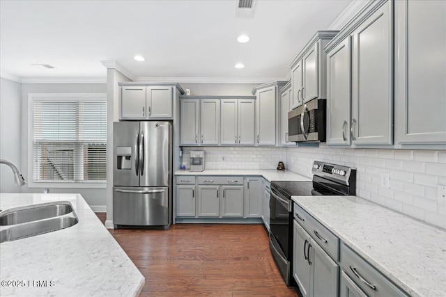 3614 Oyster Bluff Dr, Beaufort, SC 29907 - kitchen featuring gray cabinetry, dark wood-type flooring, ornamental molding, appliances with stainless steel finishes, and a sink