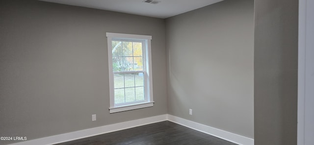 unfurnished room with dark hardwood / wood-style floors