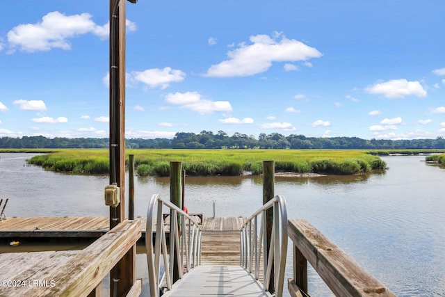 dock area with a water view and a rural view