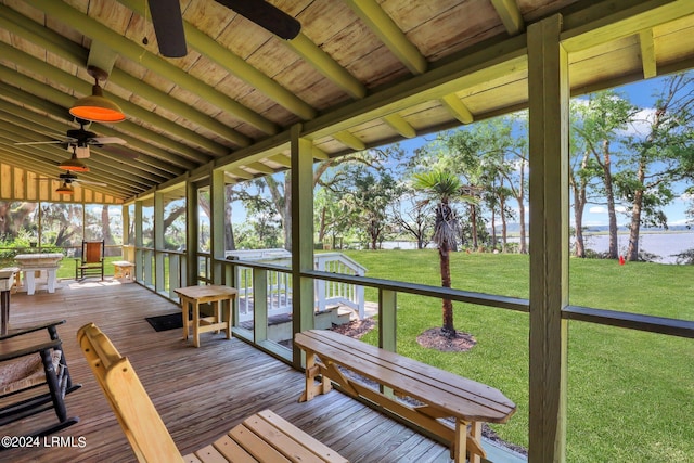 unfurnished sunroom featuring lofted ceiling and ceiling fan