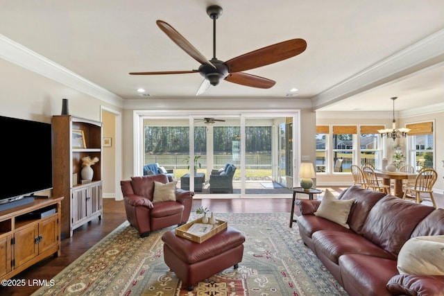 living room featuring baseboards, dark wood-type flooring, a healthy amount of sunlight, and crown molding