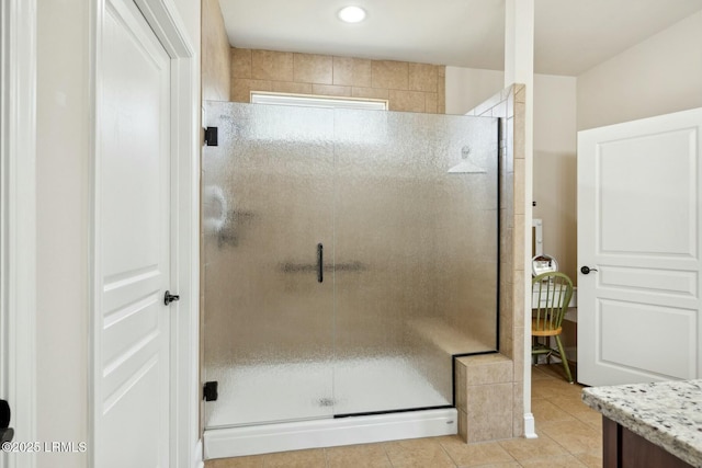 full bathroom with tile patterned floors, vanity, and a shower stall