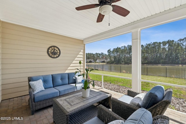 sunroom with a ceiling fan