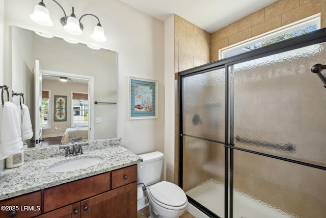 full bathroom with a shower stall, ensuite bath, vanity, and toilet