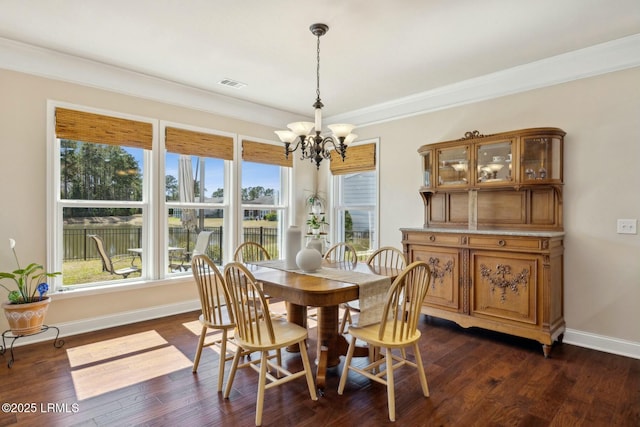 dining room featuring visible vents, plenty of natural light, and dark wood-style flooring