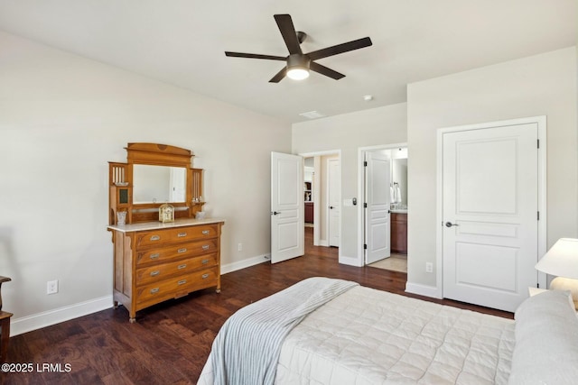 bedroom featuring ceiling fan, baseboards, ensuite bath, and dark wood finished floors