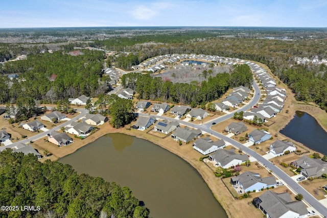 bird's eye view featuring a residential view and a water view